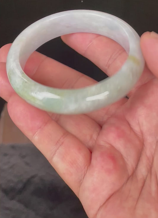 Video showcasing the soft glassy luster and fine crystalline texture of icy light lavender, milky white, and apple green Burmese jadeite bangle JB054