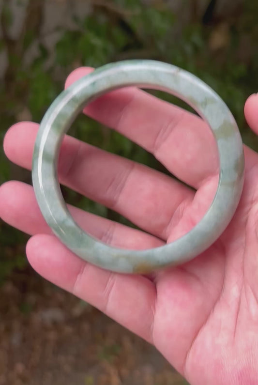 Video showcasing the natural luster and translucency of icy seafoam green Burmese jadeite bangle JB1313