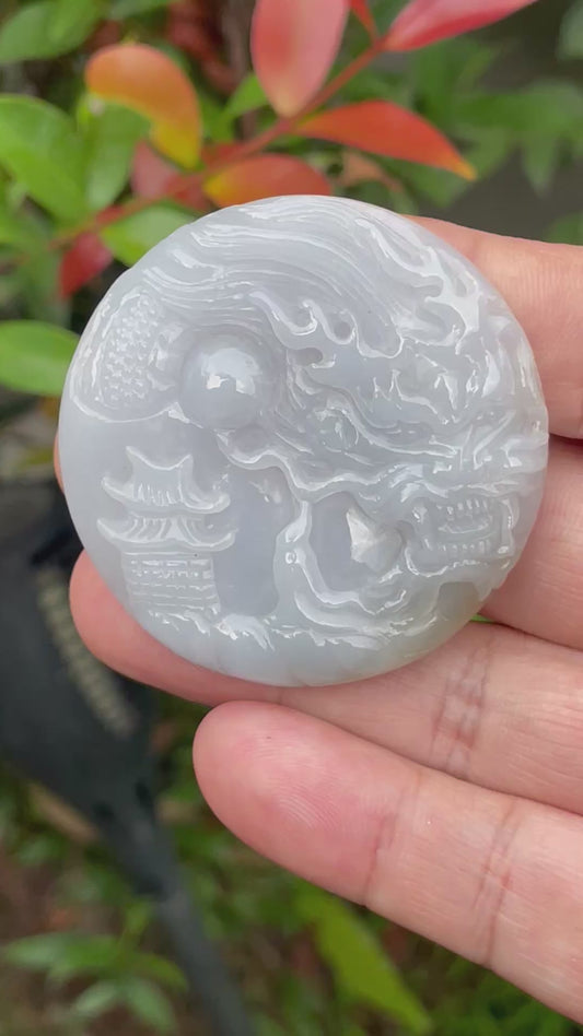 Video showcasing the smooth polished luster, icy lavender and moss green hues, and hand-carved Dragon motif of the certified Burmese jade pendant JP050