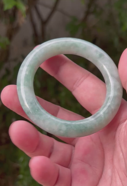 Video showcasing the natural luster and refreshing apple green hues of icy celadon Burmese jadeite bangle JB1318