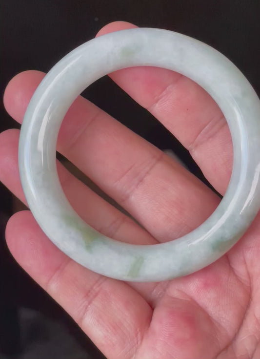 Video showcasing the bright glassy luster and fine crystalline texture of icy milky white, grey, imperial green, and apple green Burmese jadeite princess bangle JB913
