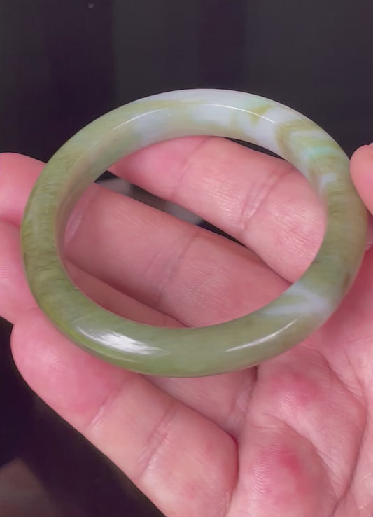 Video showcasing the natural glassy luster and fine crystalline texture of icy forest green, bluish and milky white Burmese jadeite bangle JB353