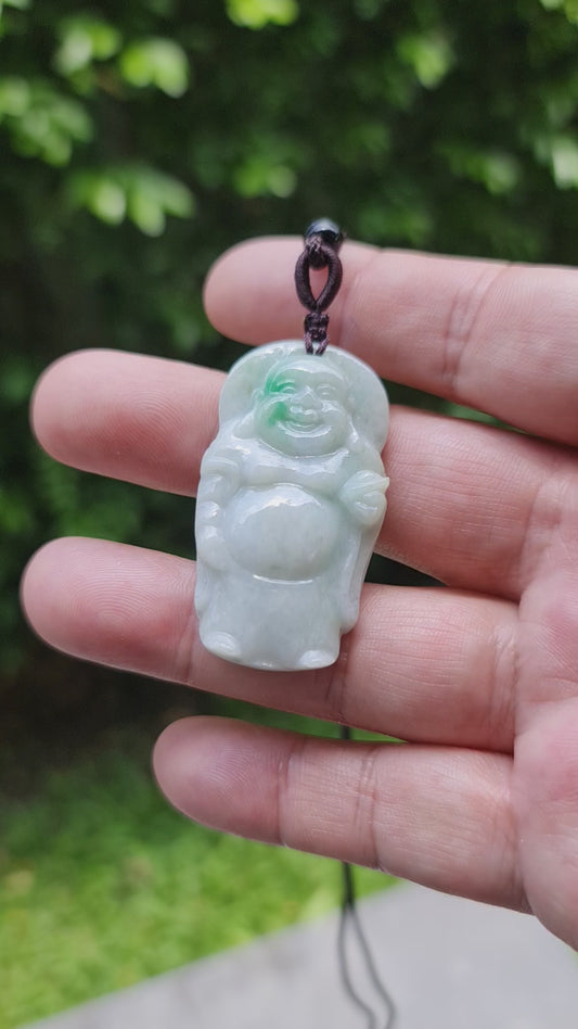 Video showcasing the soft glowing luster, icy imperial green hues, and hand-carved Happy Buddha motif of the Burmese jade pendant JP026