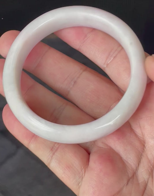 Video showcasing the vitreous luster and fine crystalline texture of icy milky white, light lavender, and apple green Burmese jadeite bangle JB829
