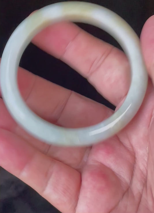 Video showcasing the bright glassy luster and fine crystalline texture of icy apple green, light lavender, and milky white Burmese jadeite bangle JB912