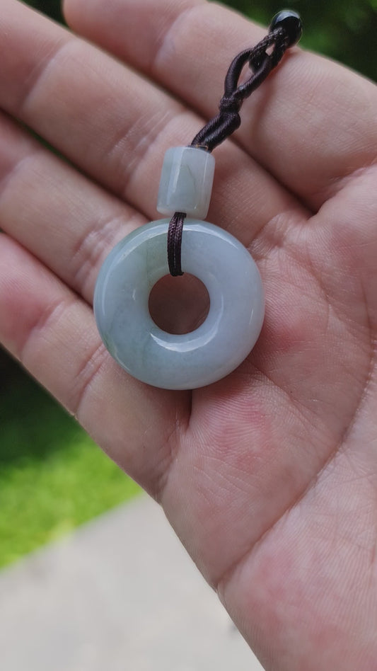 Video showcasing the vitreous luster, icy lavender and imperial green hues, and timeless donut disc shape of the Burmese jade pendant JP025