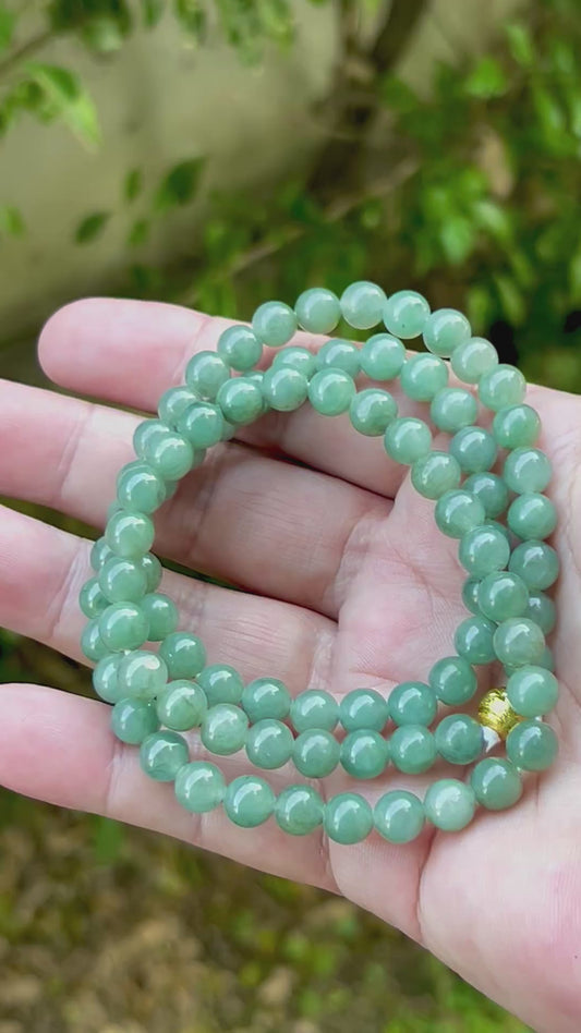 Video showcasing the soft glassy luster and elegant icy imperial white and apple green color palette of the 7.5mm certified Burmese jade bead necklace JN019