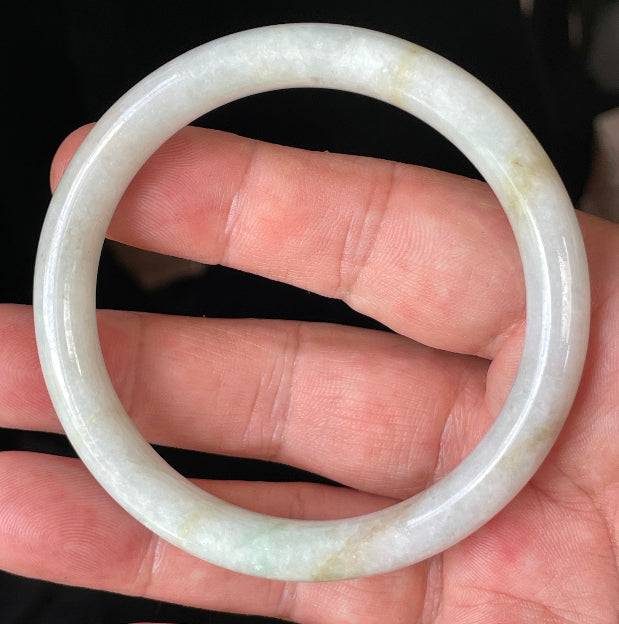 Solid icy white, apple green, and yellow natural Type A Burmese jade bangle bracelet in size 58.6mm