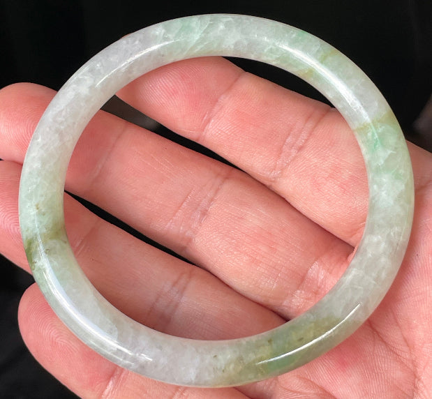 Solid icy clear, milky white, and green natural Type A Burmese jade bangle bracelet in size 58.4mm