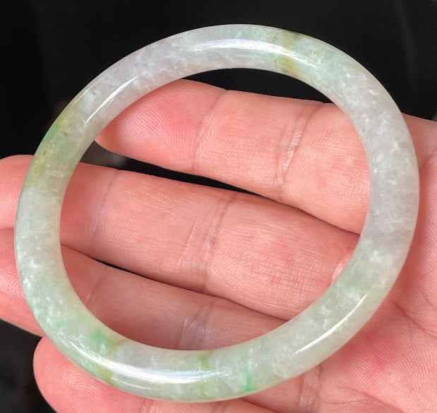 Solid icy clear, milky white, and green natural Type A Burmese jade bangle bracelet in size 58.4mm