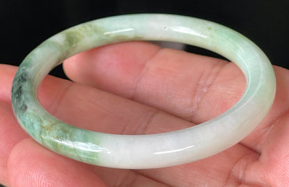 Solid icy white, forest, and apple green natural Type A Burmese jade bangle bracelet in size 50.7mm