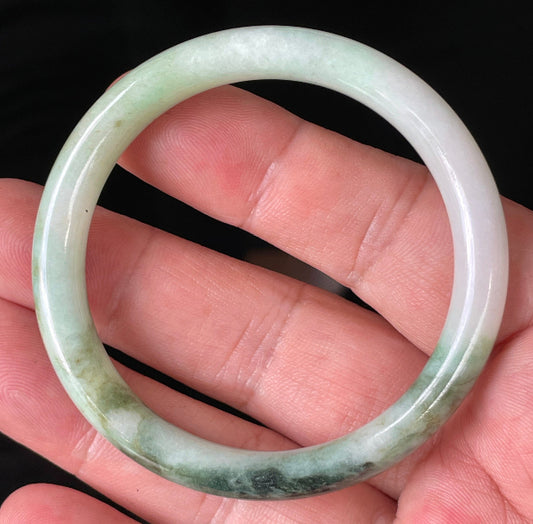 Solid icy white, forest, and apple green natural Type A Burmese jade bangle bracelet in size 50.7mm
