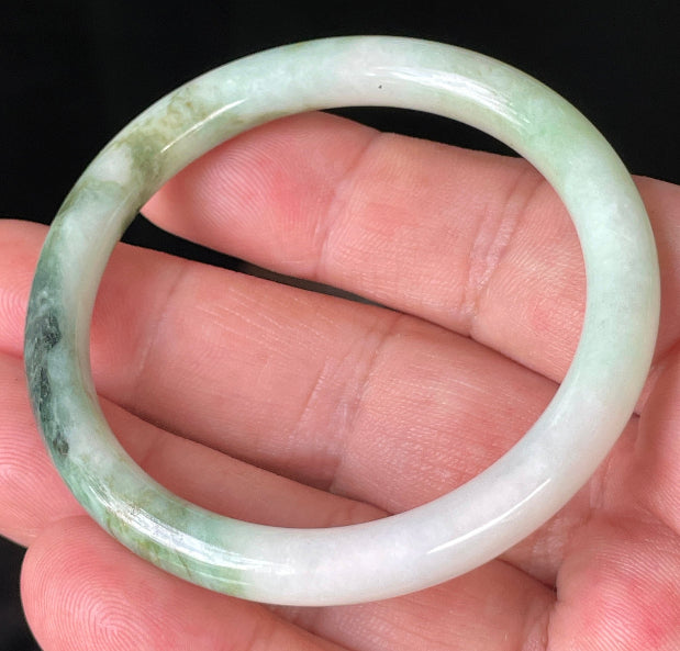 Solid icy white, forest, and apple green natural Type A Burmese jade bangle bracelet in size 50.7mm