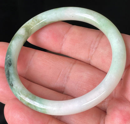 Solid icy white, forest, and apple green natural Type A Burmese jade bangle bracelet in size 50.7mm