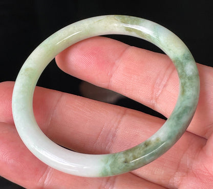 Solid icy white, forest, and apple green natural Type A Burmese jade bangle bracelet in size 50.7mm