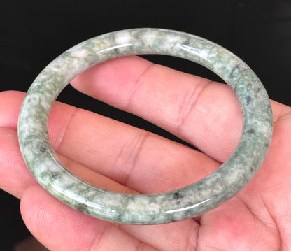 Solid icy imperial green and apple green natural Type A Burmese jade bangle bracelet in size 57mm