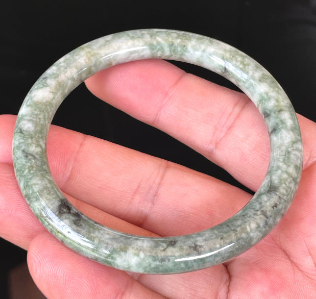Solid icy imperial green and apple green natural Type A Burmese jade bangle bracelet in size 57mm