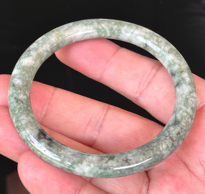 Solid icy imperial green and apple green natural Type A Burmese jade bangle bracelet in size 57mm