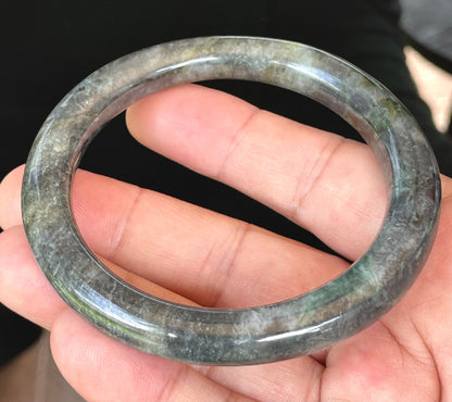 Solid icy black, grayish white, and bluish green natural Type A Burmese jade bangle bracelet in size 62.2mm