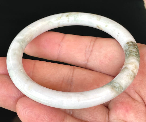 Solid icy milky white and apple green natural Type A Burmese jade bangle bracelet in size 58.5mm