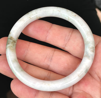 Solid icy milky white and apple green natural Type A Burmese jade bangle bracelet in size 58.5mm