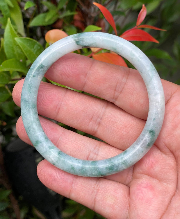 Solid icy bluish green and milky white natural Type A Burmese jade bangle bracelet in size 58.7mm