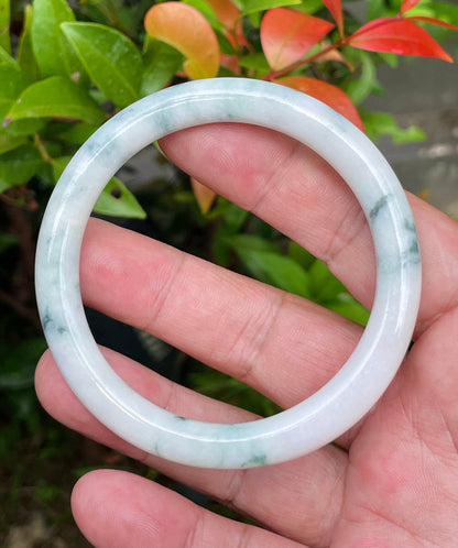 Solid milky white and imperial green natural Type A Burmese jade bangle bracelet in size 58.8mm