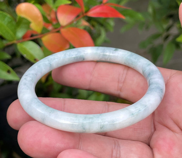 Solid icy white, imperial green, and blue natural Type A Burmese jade bangle bracelet in size 58.7mm