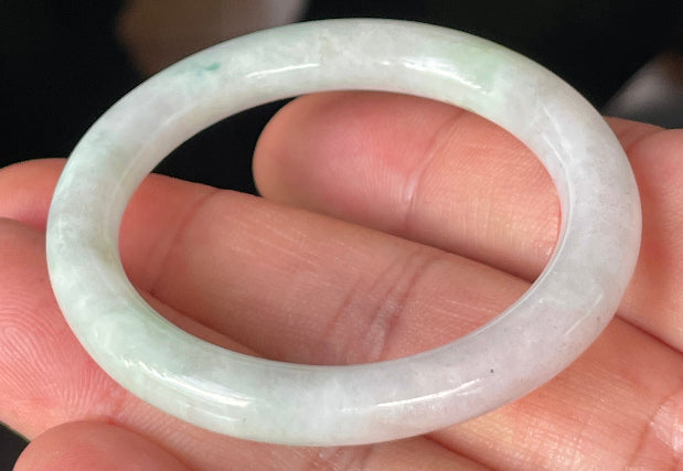 Solid icy light apple green and milky white natural Type A Burmese jade bangle bracelet in petite size 41mm