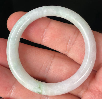 Solid icy light apple green and milky white natural Type A Burmese jade bangle bracelet in petite size 41mm