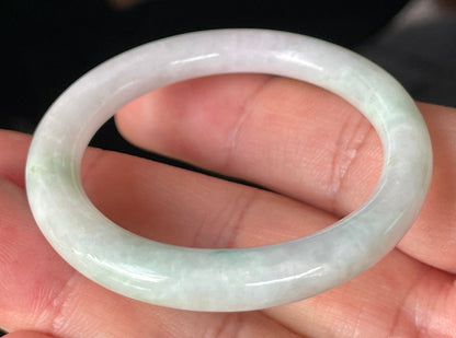 Solid icy light apple green and milky white natural Type A Burmese jade bangle bracelet in petite size 41mm
