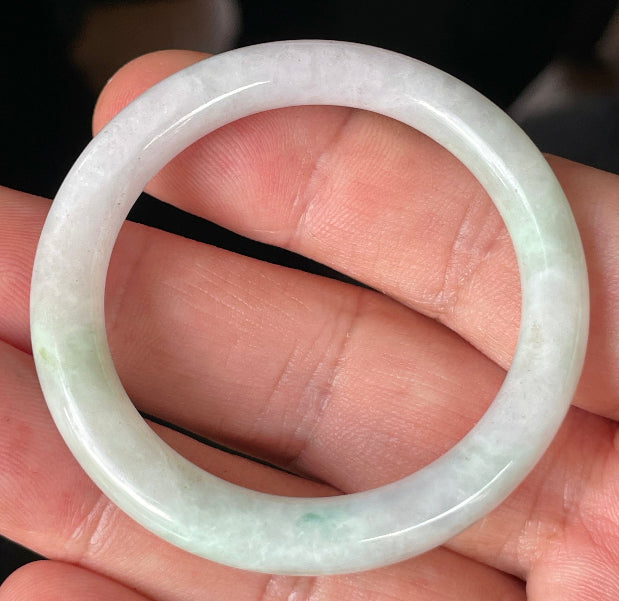 Solid icy light apple green and milky white natural Type A Burmese jade bangle bracelet in petite size 41mm