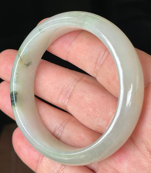 Rounded classic profile of 55mm icy light apple and forest green Burmese jade bangle JB074