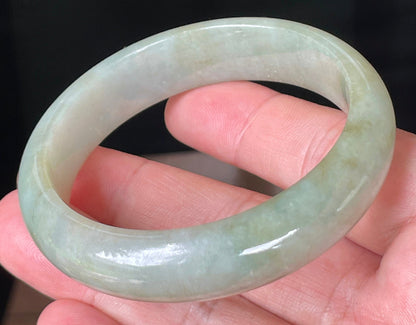 Rounded classic profile of 57.3mm icy apple green Burmese jade bangle JB073