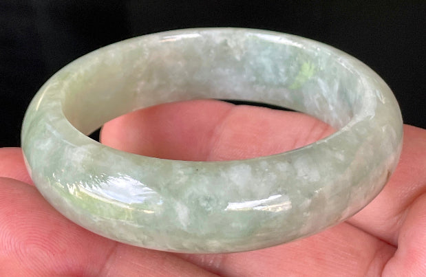 Rounded classic profile of 50.8mm icy apple green and milky white Burmese jade bangle JB238