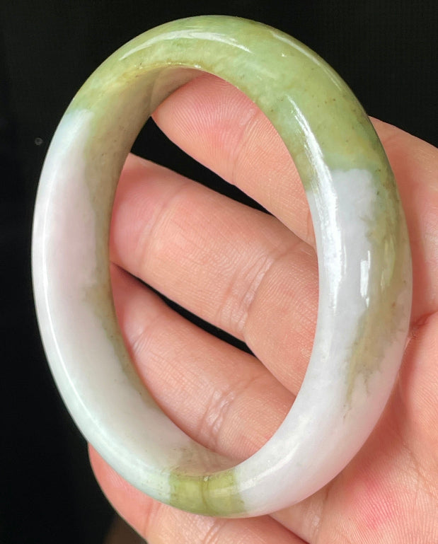 Rounded classic profile of 58.4mm icy apple green, forest green and milky white Burmese jade bangle JB078
