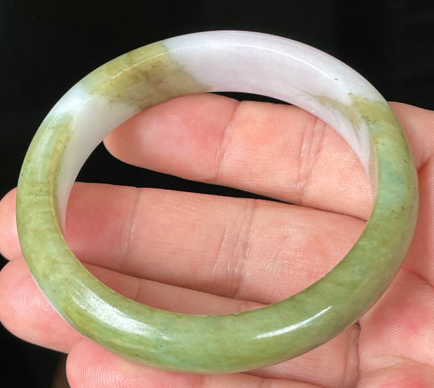 Rounded classic profile of 58.4mm icy apple green, forest green and milky white Burmese jade bangle JB078