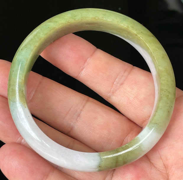 Rounded classic profile of 58.4mm icy apple green, forest green and milky white Burmese jade bangle JB078