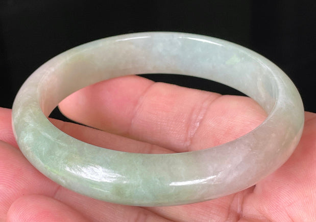 Rounded classic profile of 57mm icy apple green and milky white Burmese jade bangle JB079