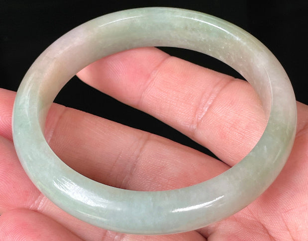 Rounded classic profile of 57mm icy apple green and milky white Burmese jade bangle JB079