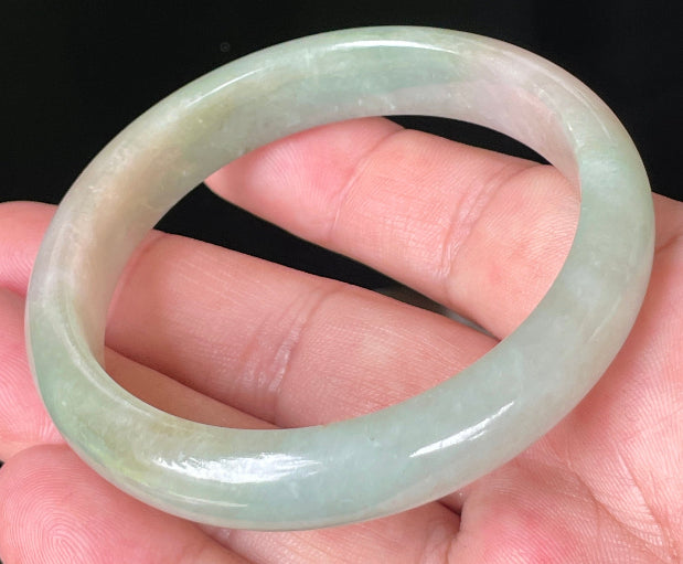 Rounded classic profile of 57mm icy apple green and milky white Burmese jade bangle JB079