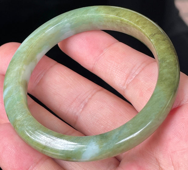 Rounded classic profile of 54.7mm icy forest green, bluish and milky white Burmese jade bangle JB353