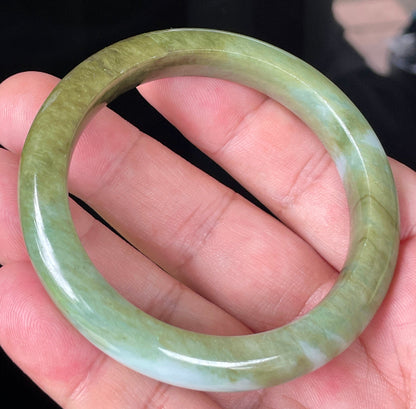 Rounded classic profile of 54.7mm icy forest green, bluish and milky white Burmese jade bangle JB353