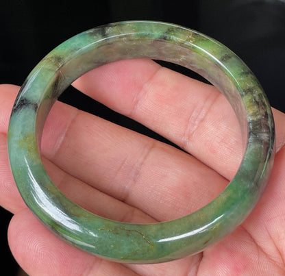 Rounded classic profile of 54.5mm icy green, black and honey Burmese jade bangle JB351
