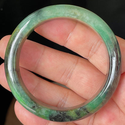 Rounded classic profile of 54.5mm icy green, black and honey Burmese jade bangle JB351