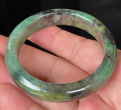 Rounded classic profile of 54.5mm icy green, black and honey Burmese jade bangle JB351