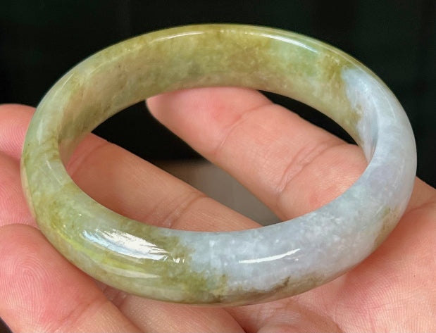 Rounded classic profile of 58.6mm icy green and honey Burmese jade bangle JB521