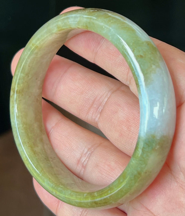 Rounded classic profile of 58.6mm icy green and honey Burmese jade bangle JB521