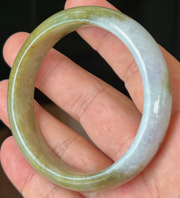 Rounded classic profile of 58.6mm icy green and honey Burmese jade bangle JB521