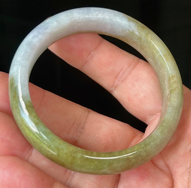 Rounded classic profile of 58.6mm icy green and honey Burmese jade bangle JB521